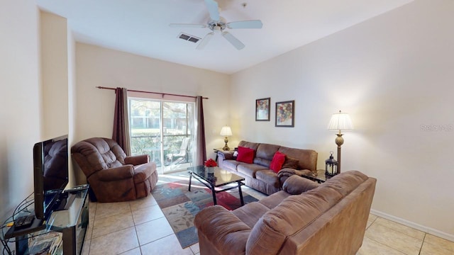 living room featuring ceiling fan and light tile patterned flooring