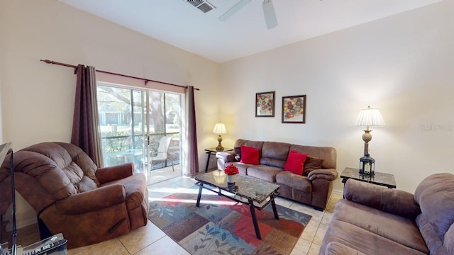 tiled living room with ceiling fan