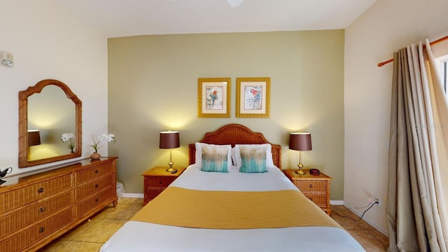 bedroom featuring light tile patterned flooring