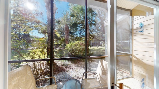 unfurnished sunroom with plenty of natural light