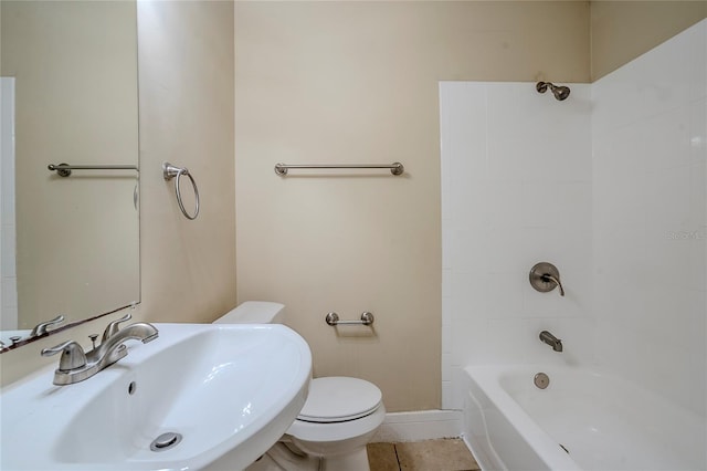 full bathroom with tile patterned floors, toilet, sink, and shower / bathing tub combination