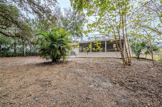 view of yard with a sunroom