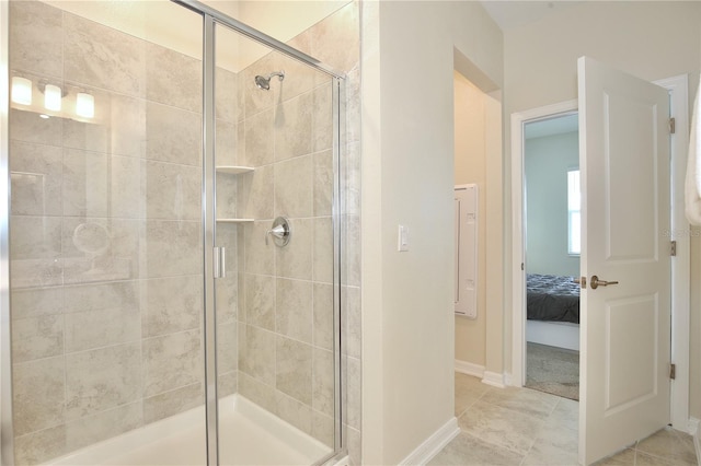 bathroom featuring tile patterned flooring and walk in shower