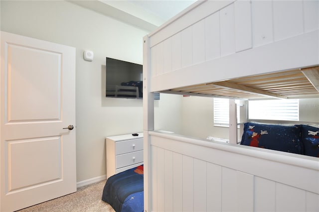 bedroom featuring light colored carpet