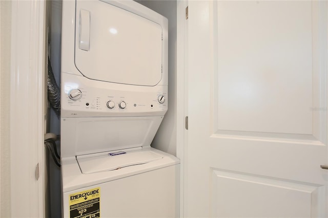 washroom with stacked washer / drying machine