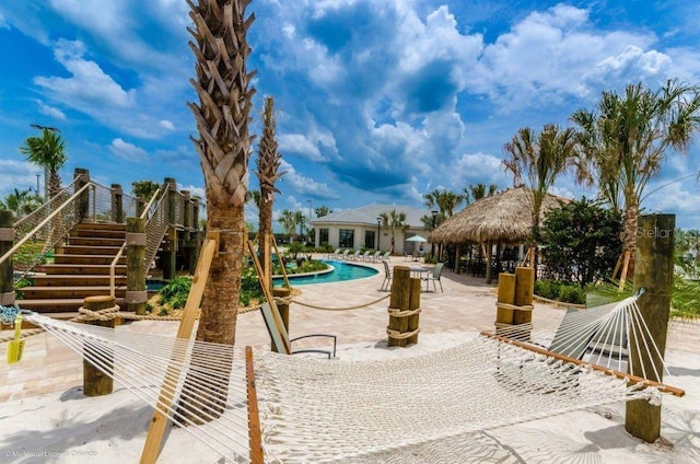 view of swimming pool with a patio and a gazebo