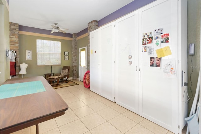 kitchen featuring white cabinets, ceiling fan, and light tile patterned flooring