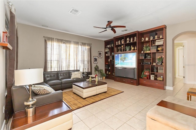 living room featuring ceiling fan and light tile patterned floors