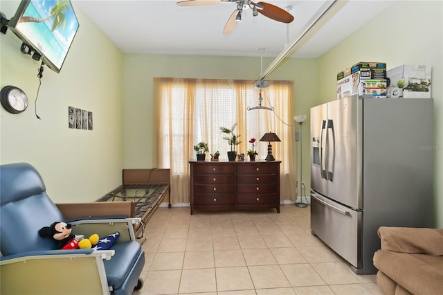 kitchen with ceiling fan, light tile patterned floors, and stainless steel fridge with ice dispenser