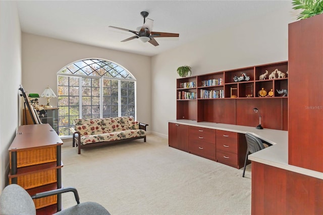 carpeted office with ceiling fan