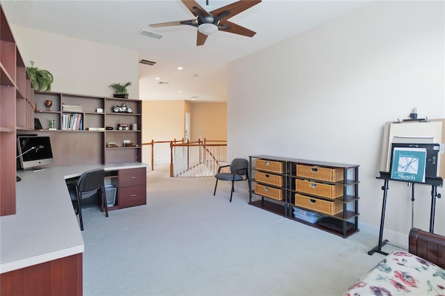 carpeted home office with ceiling fan