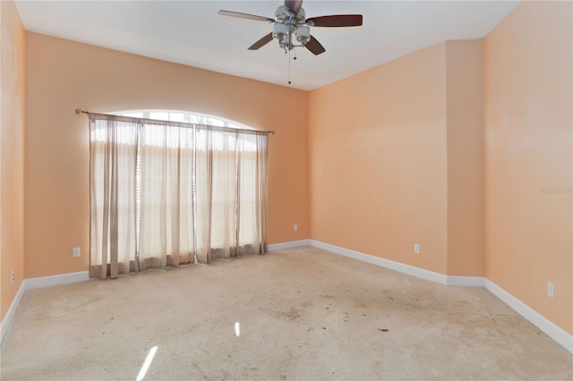 carpeted empty room with ceiling fan