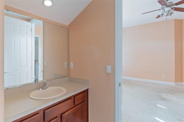 bathroom featuring lofted ceiling, vanity, and ceiling fan