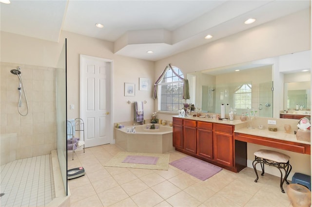 bathroom with independent shower and bath, vanity, and tile patterned floors