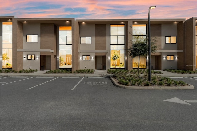 view of outdoor building at dusk