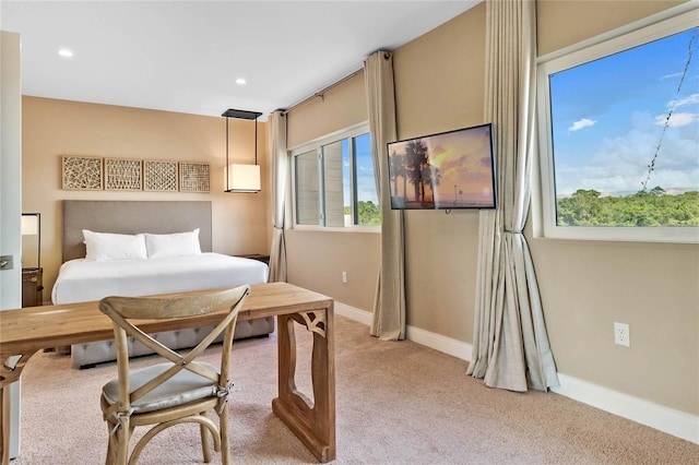 bedroom featuring light colored carpet