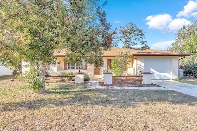 view of front of house with a front yard and a garage