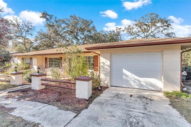 ranch-style home featuring a garage