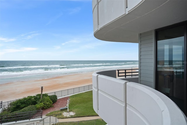 balcony with a beach view and a water view