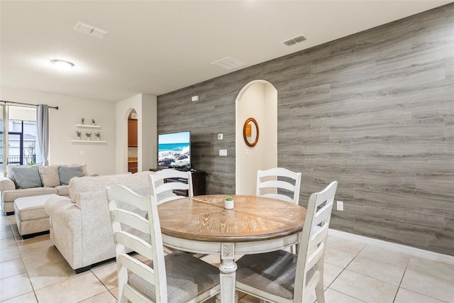 dining area featuring light tile patterned floors