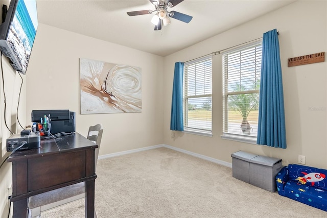 office space with light colored carpet and ceiling fan