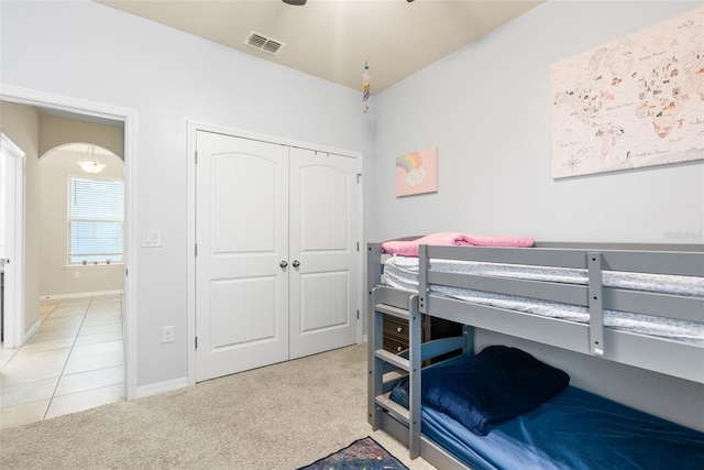 carpeted bedroom featuring a closet