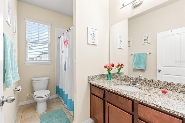 bathroom with toilet, tile patterned floors, and vanity