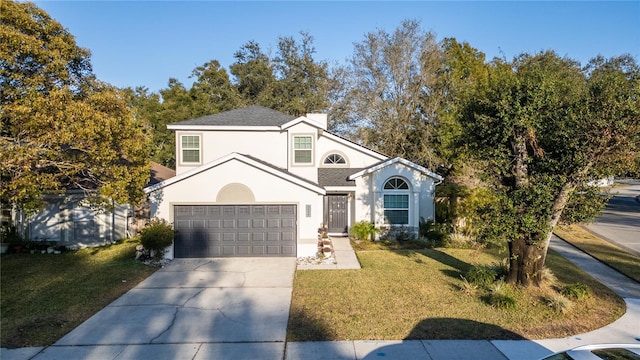 view of property featuring a front lawn