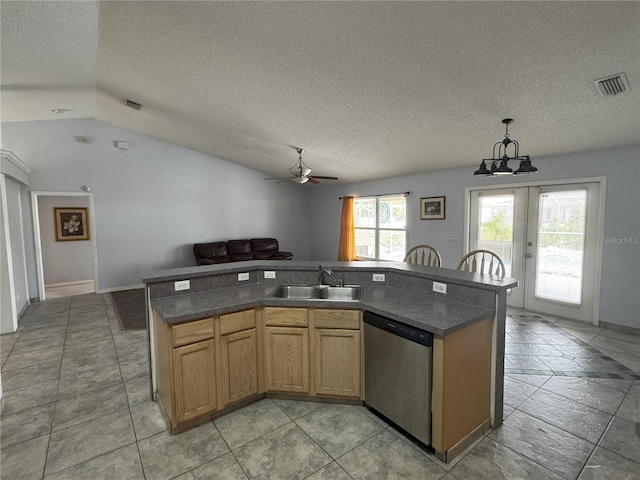 kitchen with sink, a textured ceiling, dishwasher, ceiling fan with notable chandelier, and a center island with sink