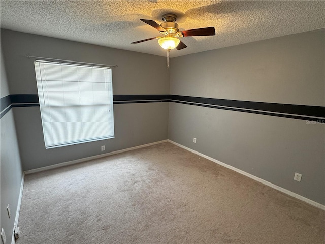 carpeted empty room with a textured ceiling