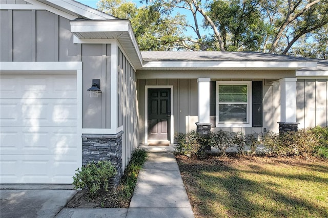 view of exterior entry featuring a garage