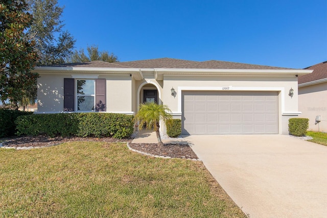 single story home featuring a garage and a front yard