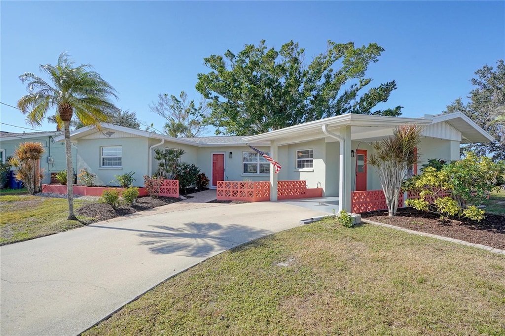 ranch-style home with a front lawn