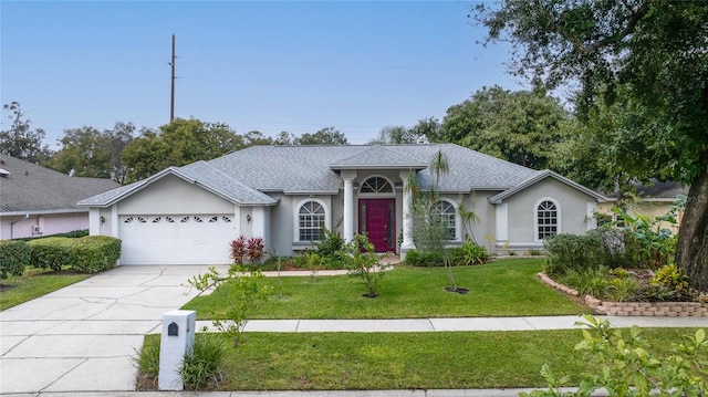 ranch-style house with a front yard and a garage