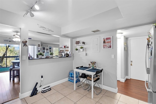 dining area featuring ceiling fan and light tile patterned floors