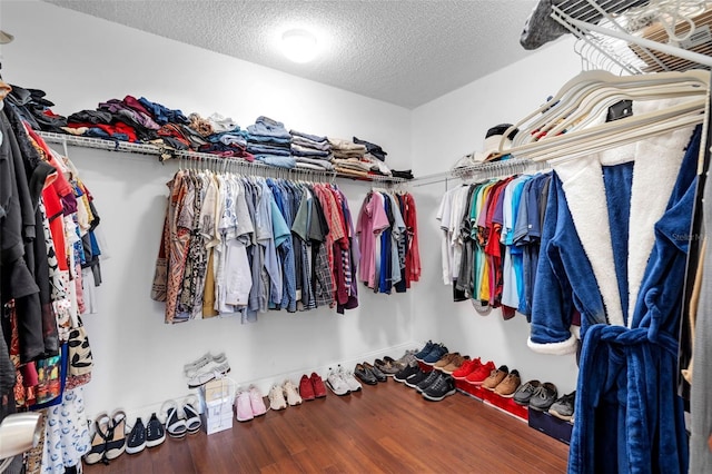 walk in closet featuring hardwood / wood-style floors