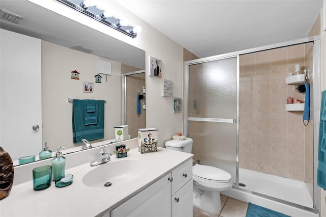 bathroom featuring vanity, an enclosed shower, tile patterned floors, and toilet