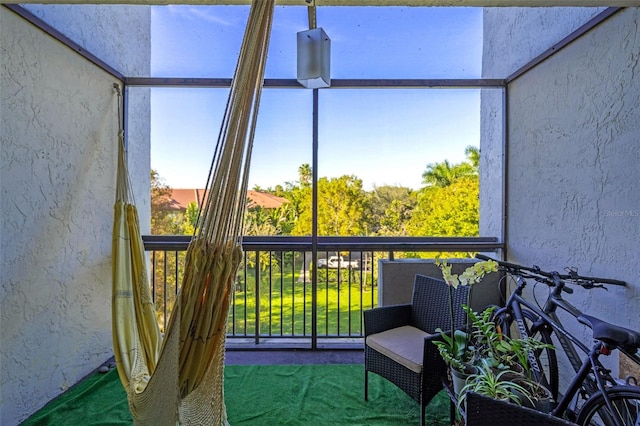 sunroom / solarium featuring plenty of natural light