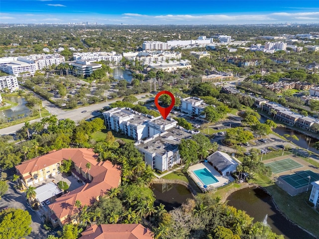 birds eye view of property with a water view