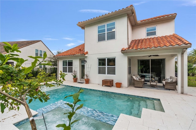 back of property featuring ceiling fan, a patio, and an outdoor hangout area