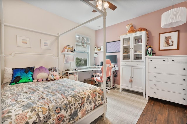 bedroom with ceiling fan and dark hardwood / wood-style flooring