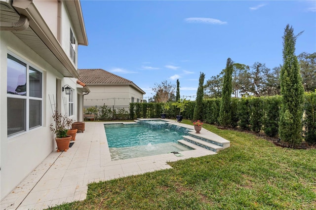 view of pool with a yard, pool water feature, and a patio area