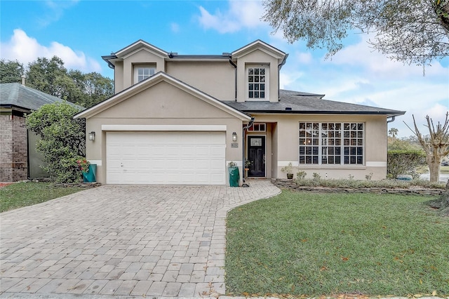 view of front facade with a front lawn and a garage