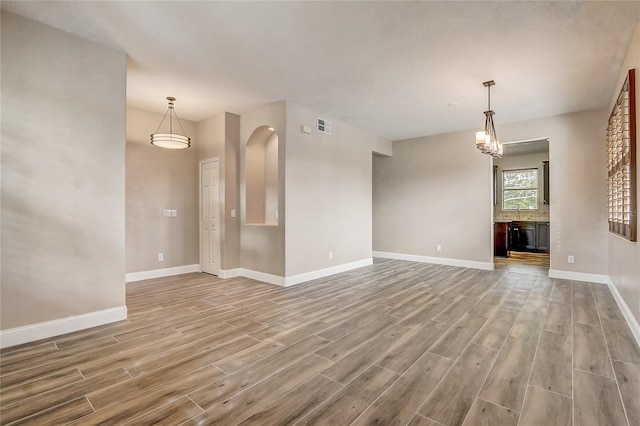 unfurnished living room featuring light wood-type flooring