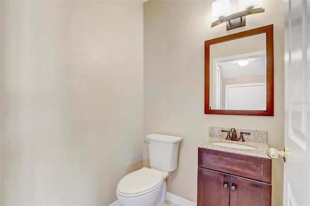 bathroom with toilet and vanity