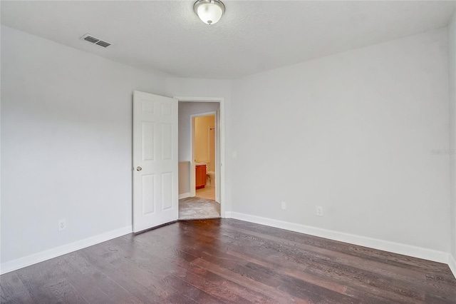 spare room featuring hardwood / wood-style floors