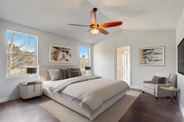 bedroom featuring ceiling fan, vaulted ceiling, and dark hardwood / wood-style floors