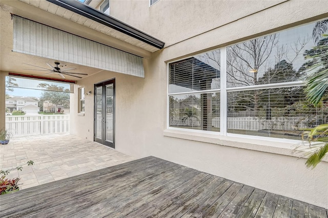 wooden deck with ceiling fan and a patio area