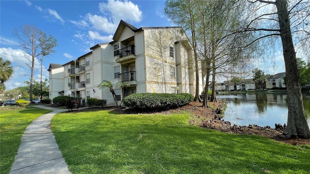 view of building exterior featuring a water view