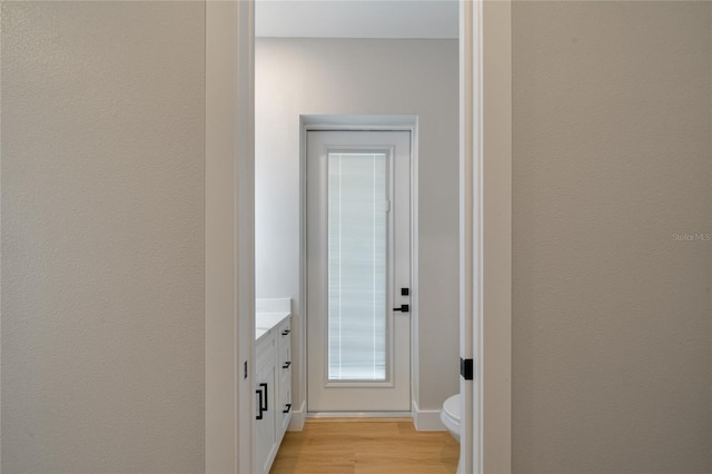 corridor featuring light hardwood / wood-style flooring